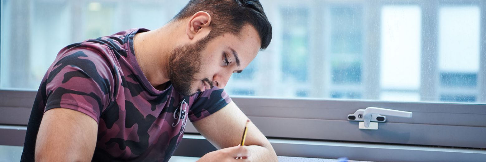 Student in class at Abbey CollegeManchester